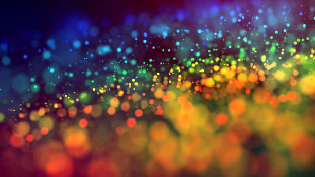 istock cloud of multicolored particles in the air like sparkles on a dark background with depth of field. beautiful bokeh light effects with colored particles. background for holiday presentations. 2 1156062191