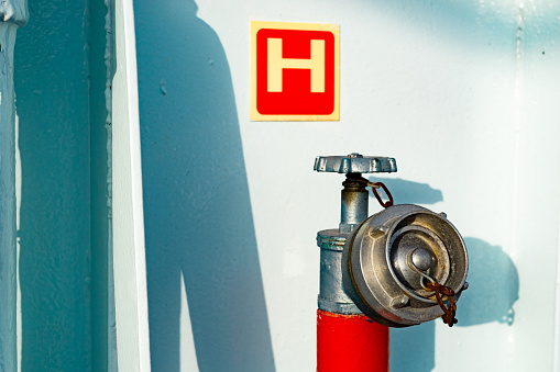 water hydrant firefighter on the ferry boat hose ship