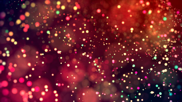 istock cloud of multicolored particles in the air like sparkles on a dark background with depth of field. beautiful bokeh light effects with colored particles. background for holiday presentations. 64 1156063169