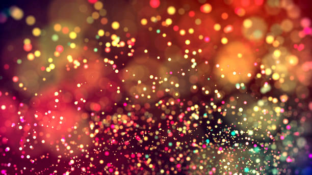 istock cloud of multicolored particles in the air like sparkles on a dark background with depth of field. beautiful bokeh light effects with colored particles. background for holiday presentations. 95 1156063392