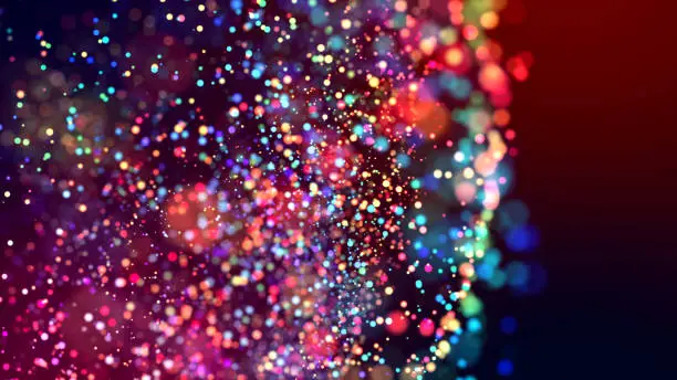 Photo of cloud of multicolored particles in the air like sparkles on a dark background with depth of field. beautiful bokeh light effects with colored particles. background for holiday presentations. 101