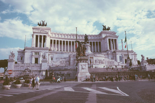 Rome, Italy - June 19, 2018: Panoramic front view of museum the Vittorio Emanuele II Monument also known as the Vittoriano or Altare della Patria on Piazza Venezia in Rome. Summer day and blue sky