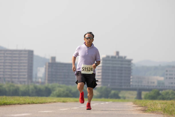istock Senior man running a race 1156065318