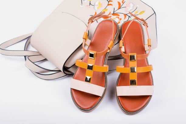 istock Fashionable women's sandals and backpack on white background 1156067626