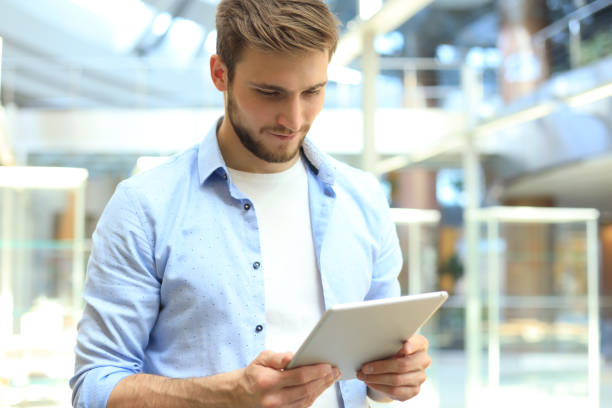 istock Businessman using his tablet in the office. 1156070448