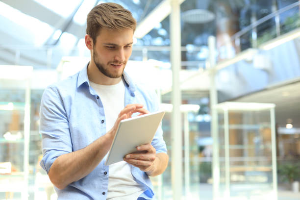 istock Businessman using his tablet in the office. 1156071116