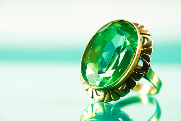 istock A ring with a sapphire on a light sapphire background 1156074107