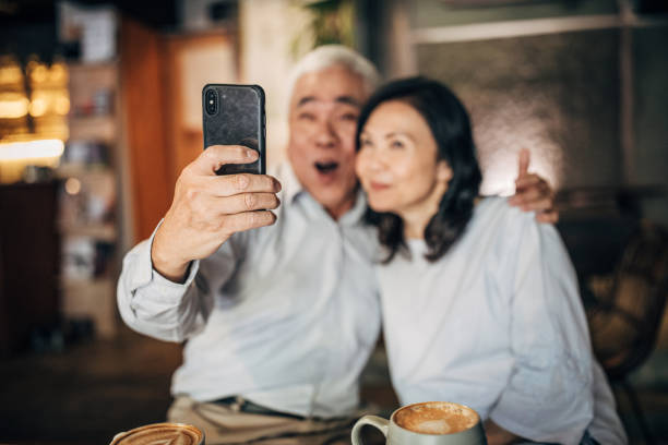 istock Senior married couple taking selfie with phone 1156077030