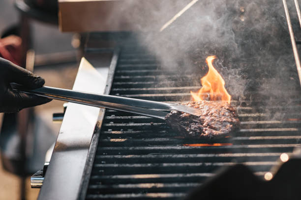 istock Burgers on the barbecue 1156082565