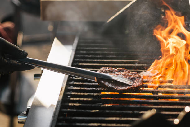 istock Burgers on the barbecue 1156082577
