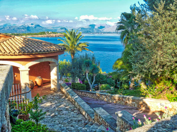 View across the bay of Alcudia towards Puerto Pollensa, Majorca, Spain Alcudia and Port Pollensa are resort towns on the North coast of Majorca bay of alcudia stock pictures, royalty-free photos & images