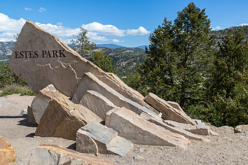 Entrance sign carved in granite of Estes Park, Colorado