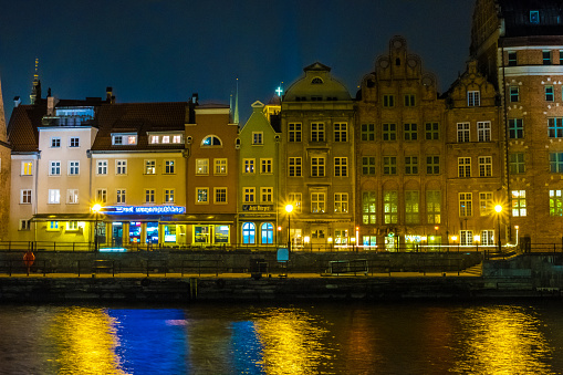 Gdansk, Poland - February 07, 2019: View of Gdansk's Main Town from the Motlawa River at night. Gdansk, Poland