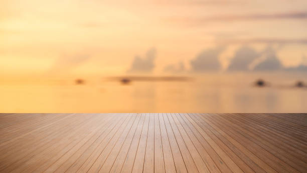 istock Wooden platform with sunset over the sea background 1156083698