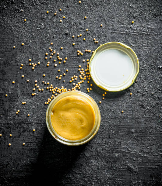 istock Mustard in a glass jar. 1156084744