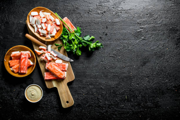 istock Sliced crab sticks with sauce and parsley. 1156084964
