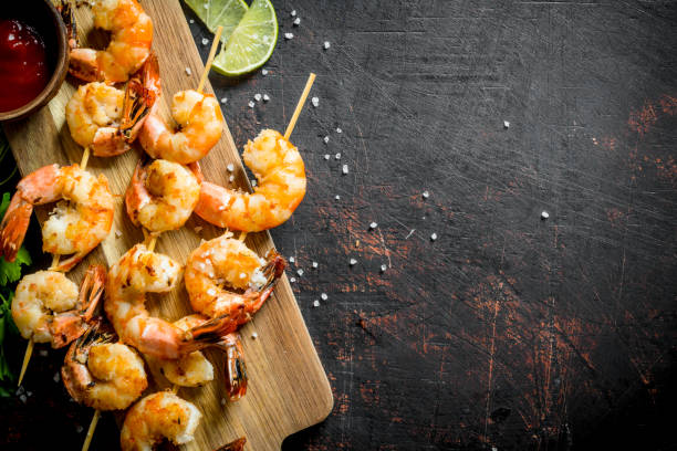 istock Fried shrimps on a cutting Board with sauce. 1156087629