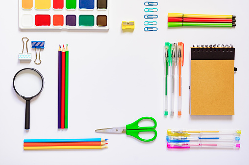 Frame with school supplies on a white background. Flat lay, top view. Back to school concept