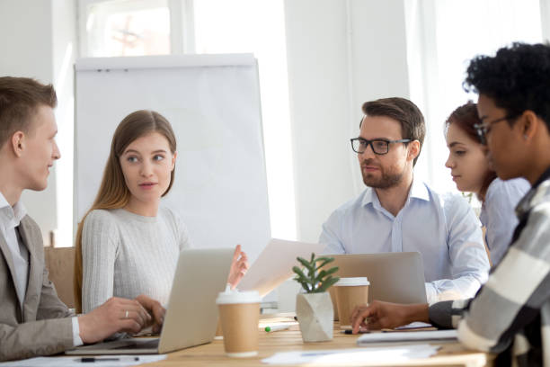 istock Five diverse multiracial businesspeople working in office room 1156088819