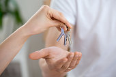 Man receiving keys from real estate agent