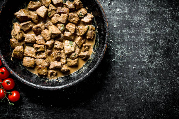 istock Pieces of liver fried in a pan. 1156089261