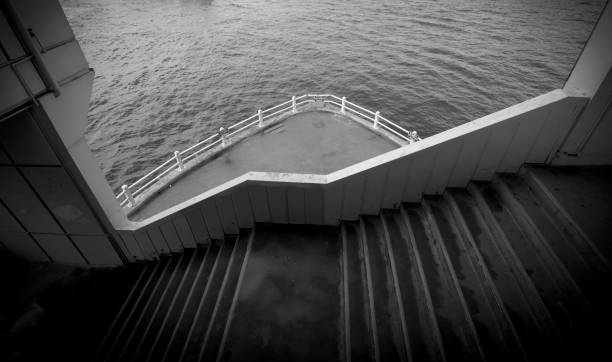 Water surrounding a traditional wooden pier