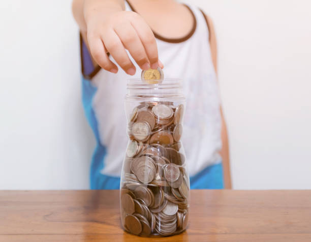 istock Child collect saving money for the future 1156089595
