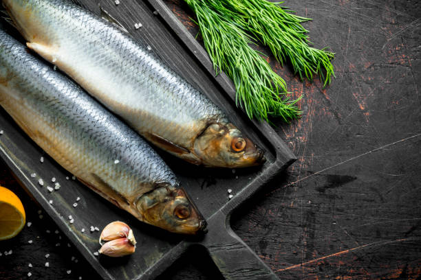 istock Salted herring with lemon, dill and spices. 1156089622