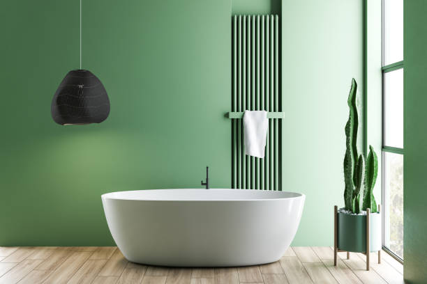 istock Green bathroom interior with white tub 1156091066