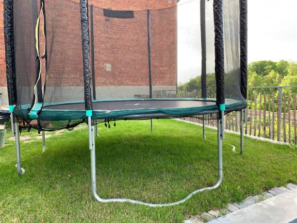 istock Round trampoline in the garden 1156091095