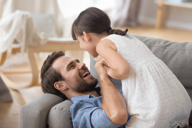 istock Happy dad and preschooler daughter have fun playing 1156092056
