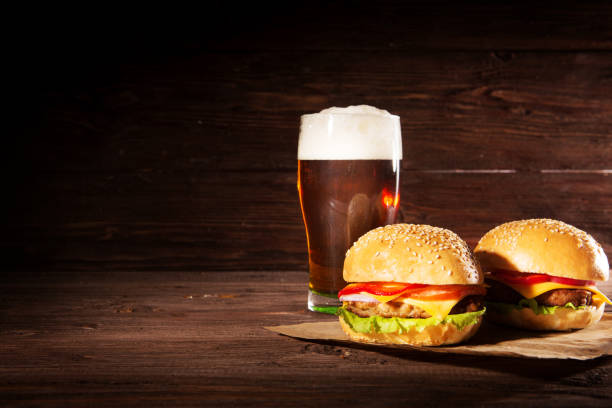 istock Hamburger and dark beer in vintage style 1156093682