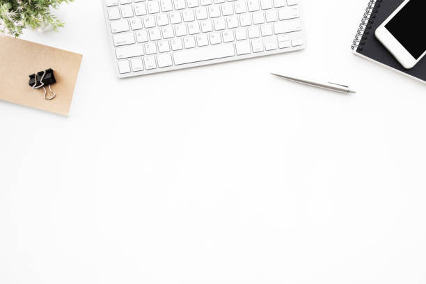 istock White office desk table with computer tools, cup of coffee and supplies. Top view with copy space, flat lay. 1156094023