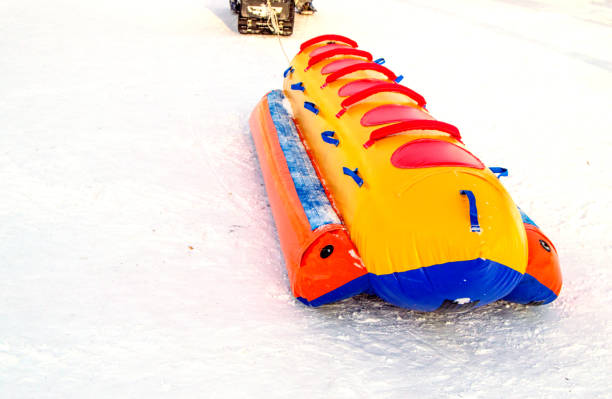 istock Inflatable rubber multi-seat sleigh for high-speed snow skiing in winter, winter activity concept and Christmas fun 1156095025