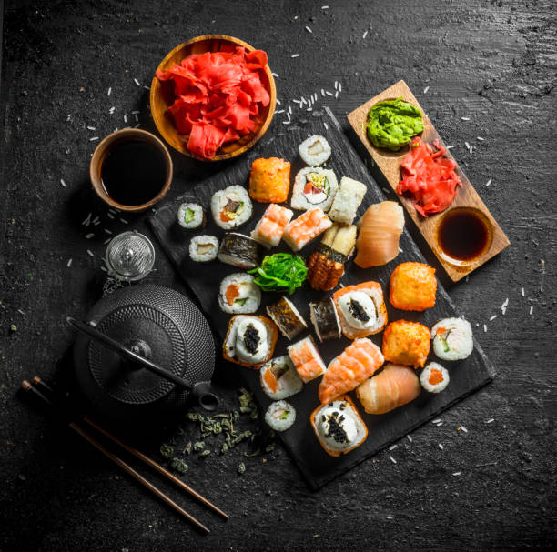 istock Japanese sushi rolls with salmon, avocado and shrimp. 1156095861