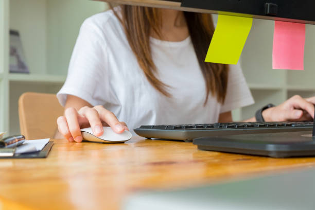 istock young Asian man and woman at office 1156096403