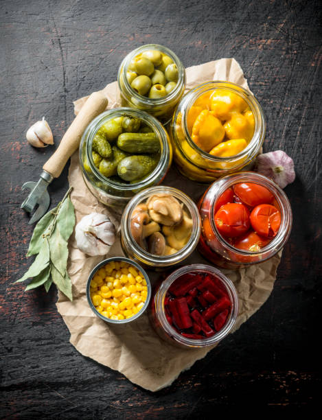 istock Preserved vegetables on paper with garlic and Bay leaf. 1156097737