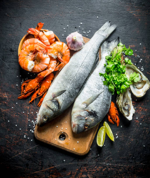 istock Fresh fish on a cutting Board with oysters, shrimp and crayfish. 1156098883