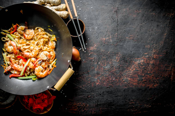 istock Readymade Chinese Udon noodles with shrimp, vegetables and sauce. 1156099051