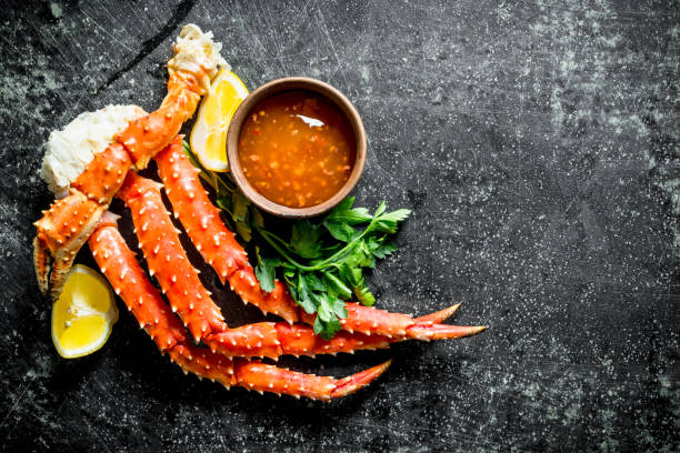 istock Crab with sauce, herbs and lemon. 1156102677