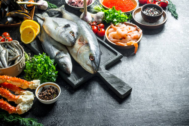 istock Fresh fish with shrimp, crab and herbs. 1156102745