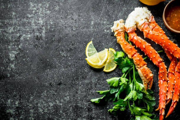 istock Crab with parsley, lemon slices and sauce. 1156103092