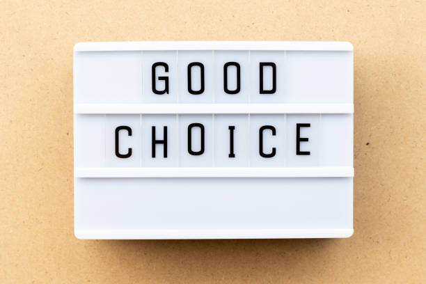 istock Light box with word good choice on wood background 1156103113