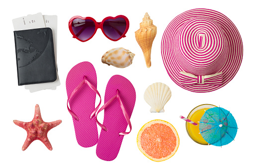 Summer holiday vacation concept with beach and travel accessories isolated on white background. Top view from above