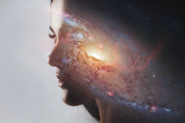 The universe inside us, the profile of a young woman and space, the effect of double exposure. stock photo