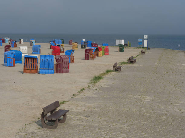 istock the small harbor of nessmersiel in germany 1156105380