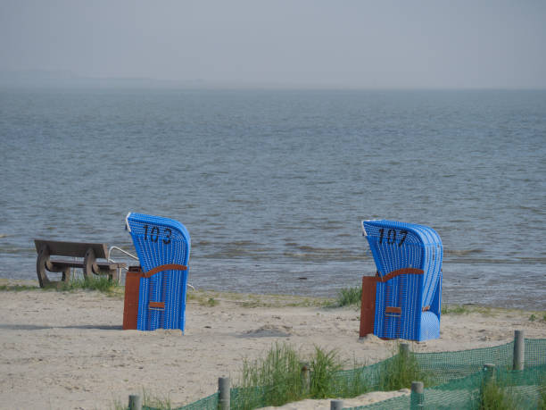 istock the small harbor of nessmersiel in germany 1156105445