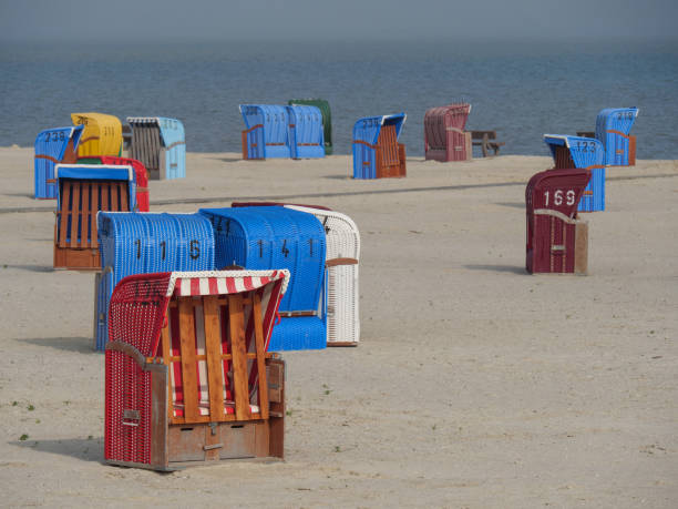 istock the small harbor of nessmersiel in germany 1156105520