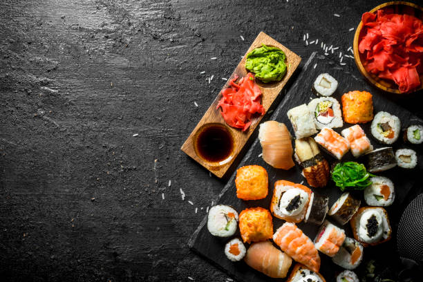 istock Japanese sushi rolls with salmon, avocado and shrimp. 1156106342