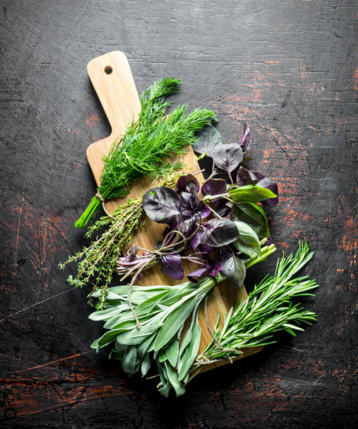 istock Various types of useful herbs on a wooden cutting Board. 1156106882